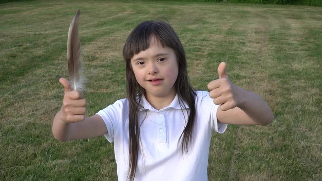 Down syndrome girl have fun outside
