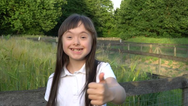 Down syndrome girl have fun outside