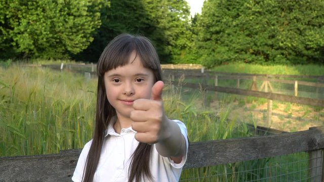 Down syndrome girl have fun outside