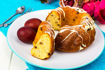 Easter cake and painted red eggs