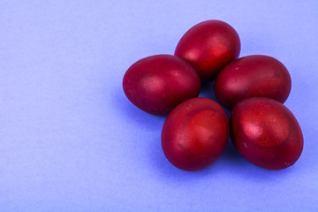 Easter red eggs on bright background
