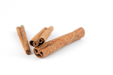 Pieces of cinnamon isolated on a white background.