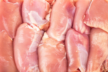 Fresh raw chicken meat in white plastic container