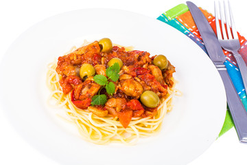 Spaghetti, chicken fillet with vegetables and olives