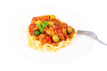 Spaghetti, chicken fillet with vegetables and olives