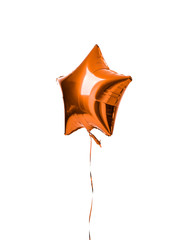 Single light orange color metallic star balloon object for birthday party isolated on a white