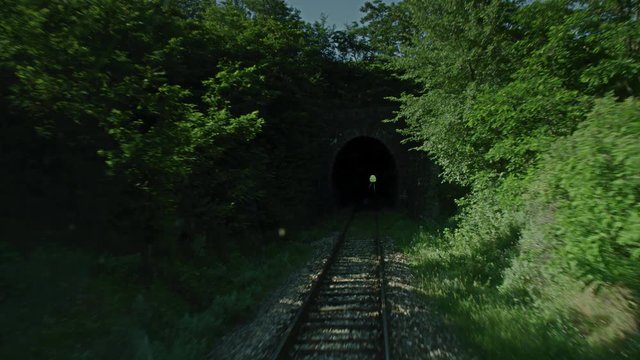 A train entering a tunnel.