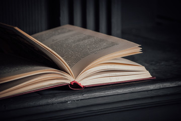 living room decor elemens: candlestick, fireplace and books