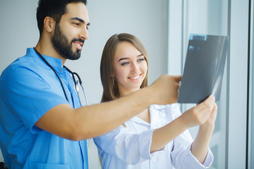 Doctors team examining a patient's x-ray