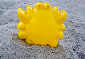 Fototapeta na wymiar Children toy on sand