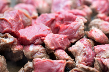 Pieces of beef cooking in frying pan