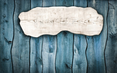 wooden plaque on a wooden fence