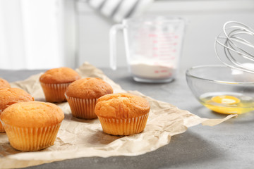 Tasty cupcakes on table. Fresh from oven