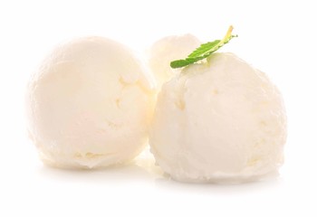 Balls of delicious vanilla ice cream on white background