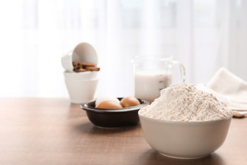 Bowl with flour on kitchen table