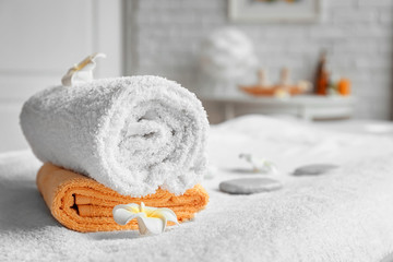 Obraz na płótnie Canvas Towels on massage table in spa salon