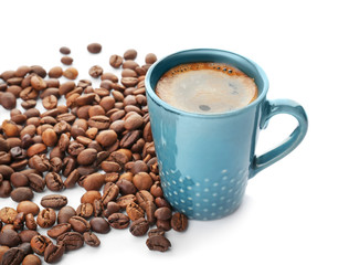Cup of aromatic hot coffee and beans on white background