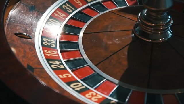 A Shot Of A Casino Roulette In Motion,the Ball Stops At 27 Red Thirty Six/Better Luck Next Time