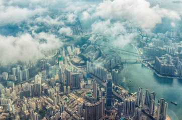 Bird's eye or aerial view through the clouds to large metropolis city of Hong Kong. - 198668626