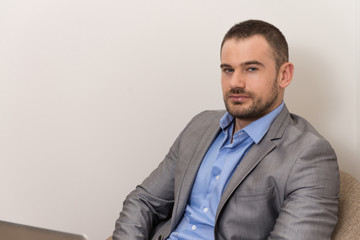 Man Working on Laptop at Home