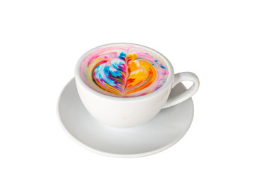 Colorful rainbow latte coffee in white cup on wooden table with copy space for text or design