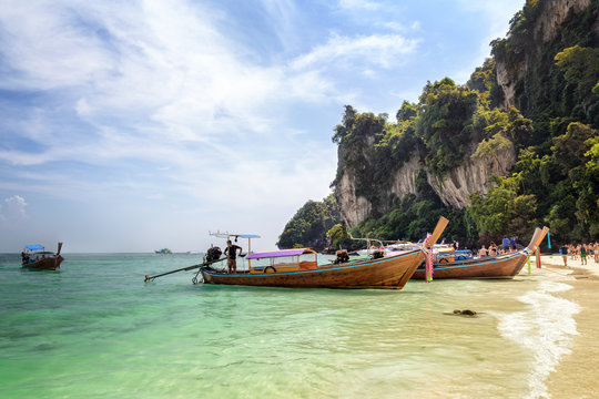 View to the famous Monkey Beach with longtail boats and tourists, on Phi Phi Don island, Phi Phi Islands, Krabi Thailand