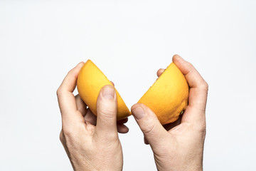 a cut orange in hand