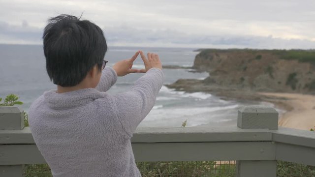 Woman enjoying view of Australian beach landscape