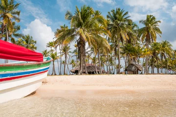 Fotobehang Tropisch strand Beach palm trees and boat on caribbean island
