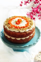 Homemade Layered Carrot cake with frosting on white background