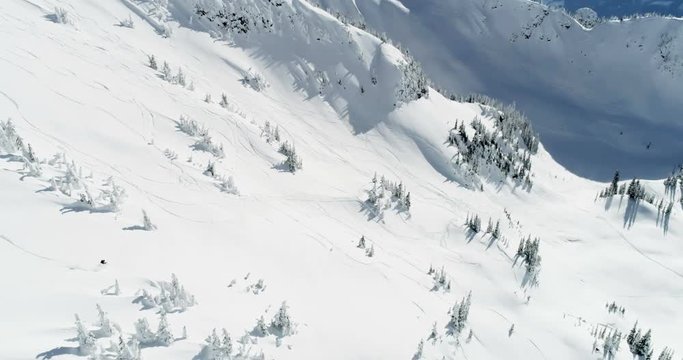 Skier skiing on a snow capped mountain