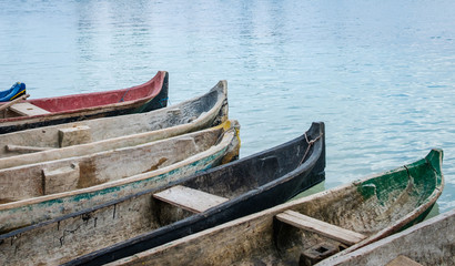 Fototapeta na wymiar traditional wooden canoe boats at waterside , paddle boat