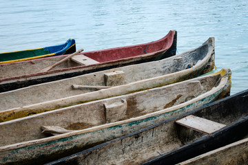  canoe boats at waterside , paddle boat