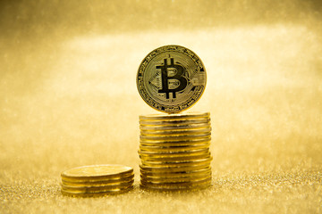  cryptocurrencys bitcoin on gold background.