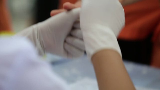 Health and Medical concept. Taking blood on finger for analysis test in clinical. Blood test is laboratory analysis performed on sample that usually extracted from vein in arm using hypodermic needle.