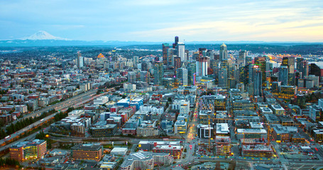 Fototapeta na wymiar Seattle Washington Infrastructure Helicopter Aerial Angle Above City Downtown Core Facing Huge Mount Rainier Large Cascade Mountain Pacific Northwest