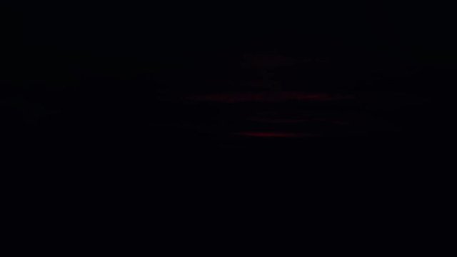 The sun rises above the horizon, time lapse