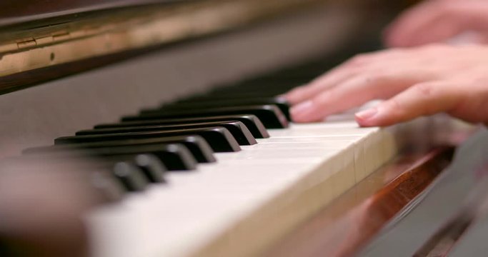 Man practicing piano at home