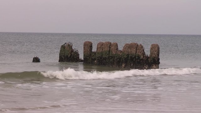 Cost protection groins at the beach of Sylt, Germany. Buhnen f&uuml;r K&uuml;stenschutz, am Strand von Sylt, Deutschland