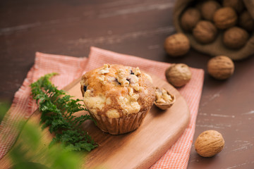 Tasty homemade walnut muffins on table. Sweet pastries