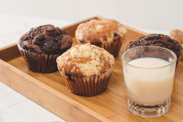 Breakfast with fresh homemade delicious muffins and milk.