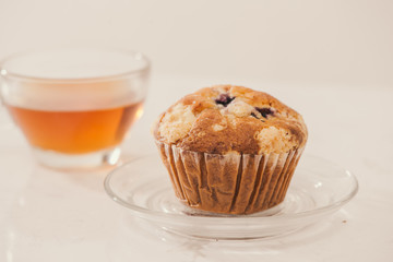Breakfast with fresh homemade delicious muffins and tea.