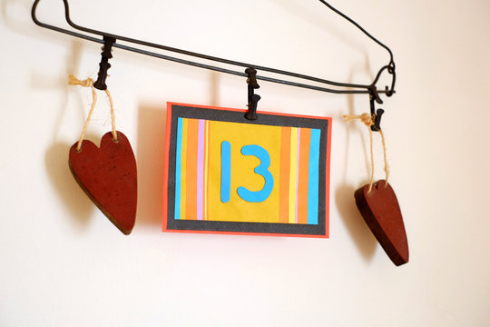 Number 13 anniversary celebration card against a bright white background