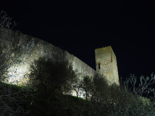 Monteriggioni, Siena, Italy. Night landscape of the outer walls of the village. Tuscany, Italy
