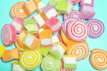 Jelly sweet candies on cyan background.