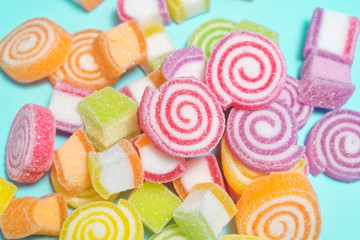 Fototapeta na wymiar Jelly sweet candies on cyan background.