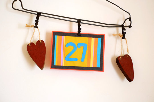 Number 27 anniversary celebration card against a bright white background