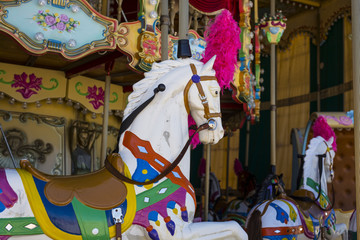 Fototapeta na wymiar detail of an ancient carousel horse with many colors