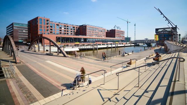 Time lapse of pedestrians and tourists walking at Magdeburger Hafen in modern, urban Hafencity Hamburg, Germany