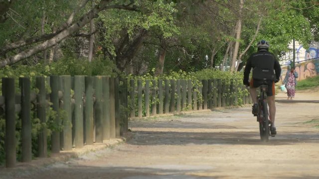Riding a bike in a park